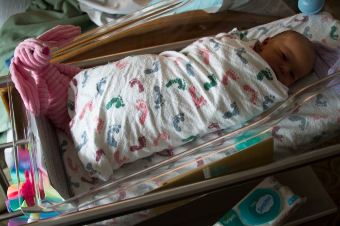 Maisie in her Hospital Crib