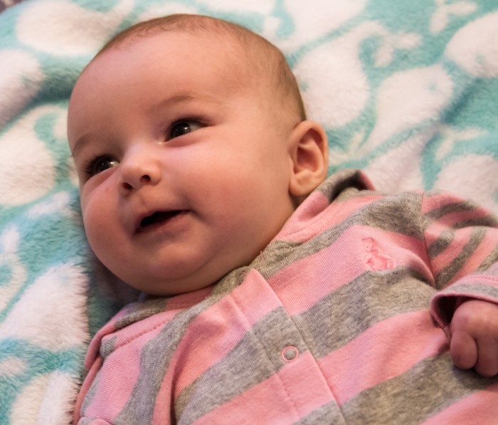 Maisie smiling at 8 weeks.