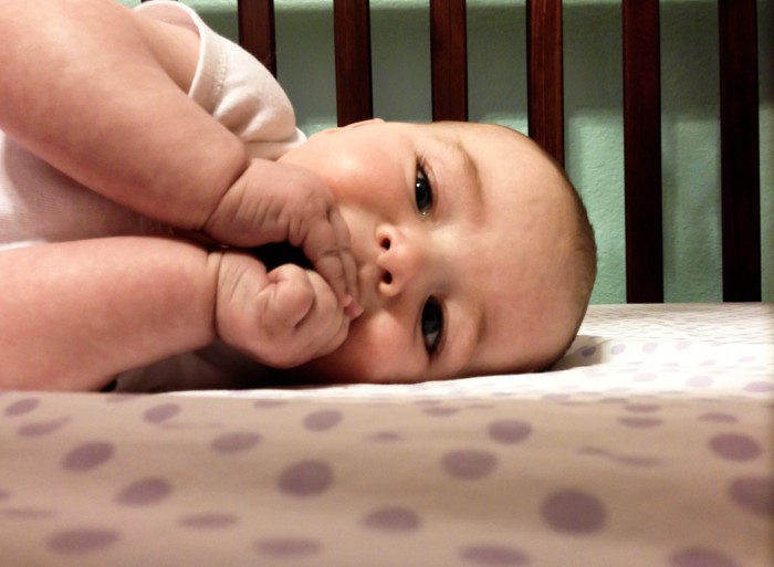 Maisie In Her Crib